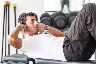 man exercising in gym